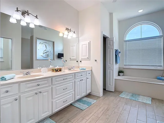 a view of a backyard with a garden and entertaining space