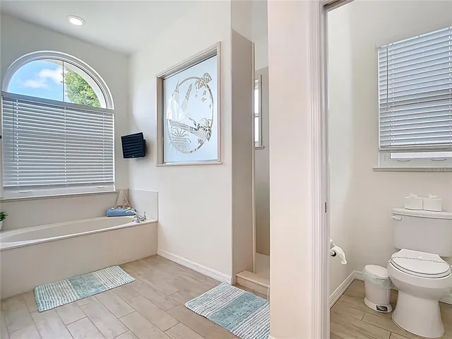 a view of a house with a swimming pool and a big yard