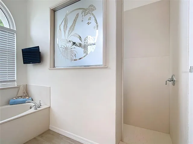 an aerial view of multiple houses with yard