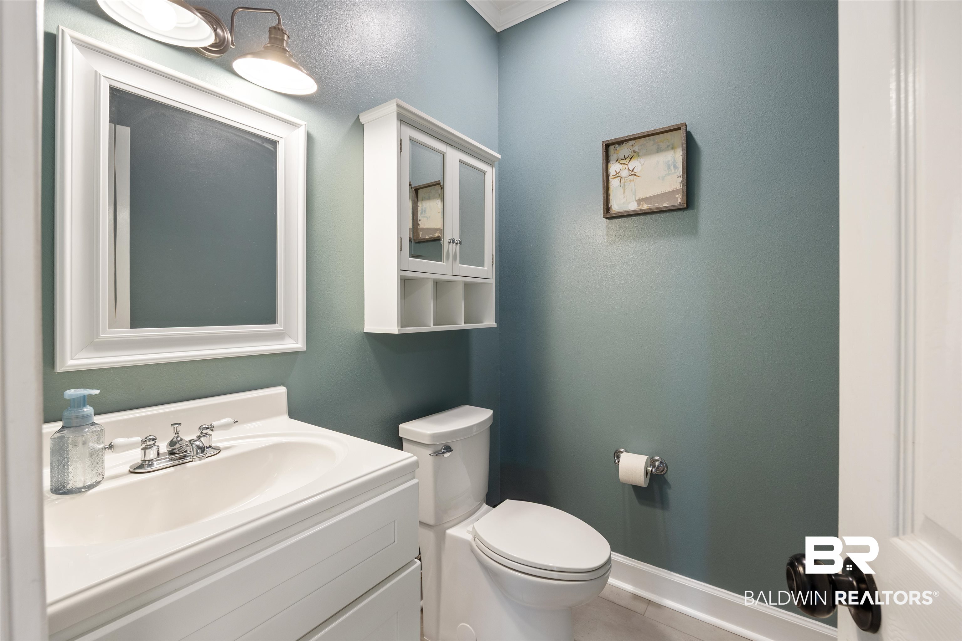 9855 Stucki Road Elberta, AL 36530 - Photo 26 of 54 Bathroom featuring vanity and crown molding