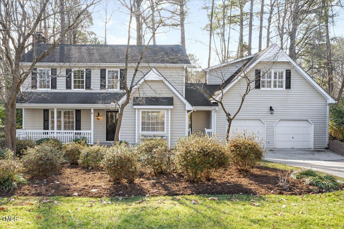 2205 Pastille Lane Raleigh, NC 27612 - Photo 1 of 31 a front view of a house with a yard