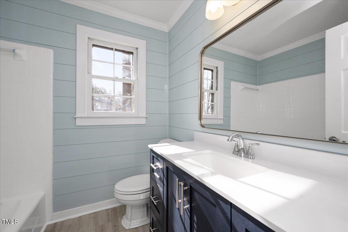 2205 Pastille Lane Raleigh, NC 27612 - Photo 14 of 31 a bathroom with a sink a toilet and a mirror