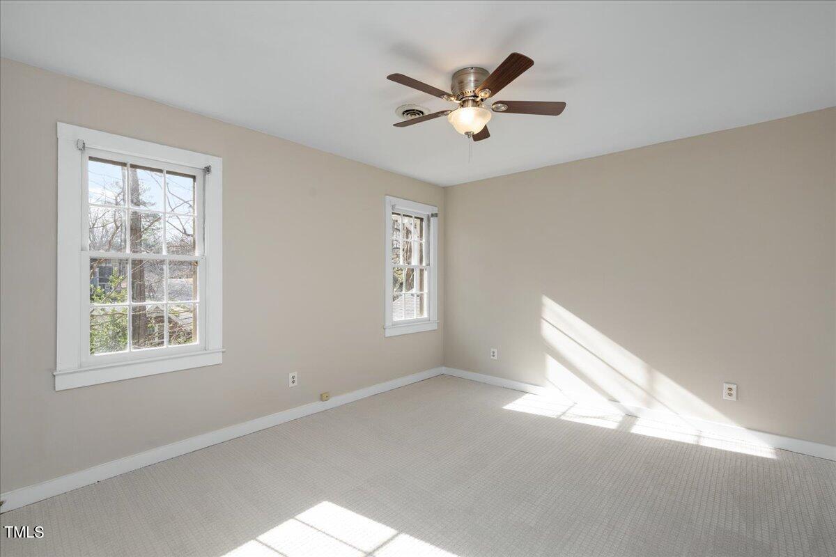 2205 Pastille Lane Raleigh, NC 27612 - Photo 16 of 31 a view of a livingroom with a ceiling fan and window