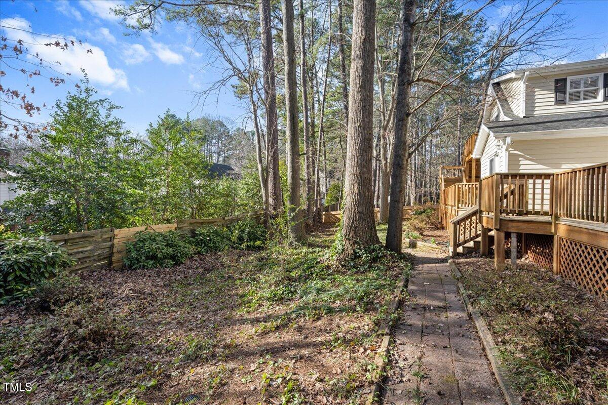 2205 Pastille Lane Raleigh, NC 27612 - Photo 28 of 31 a backyard of a house with lots of green space