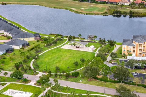 an aerial view of a house with a swimming pool