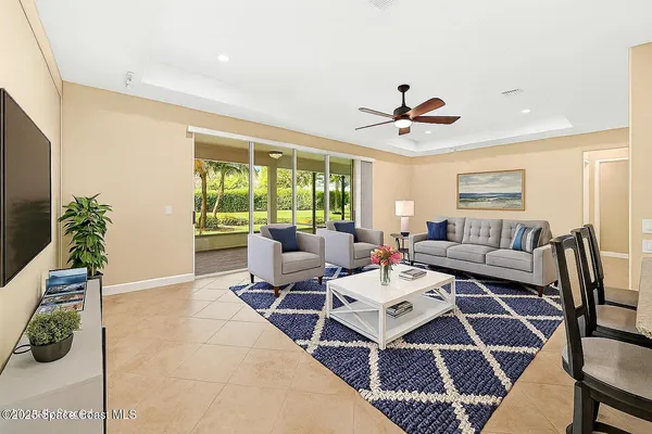 a view of kitchen with furniture and stainless steel appliances