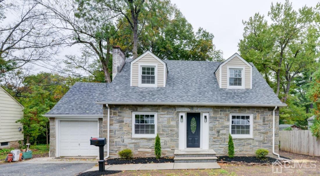 420 Chain O' Hills Road Colonia, NJ 07067 - Photo 1 of 37 a front view of a house with garage