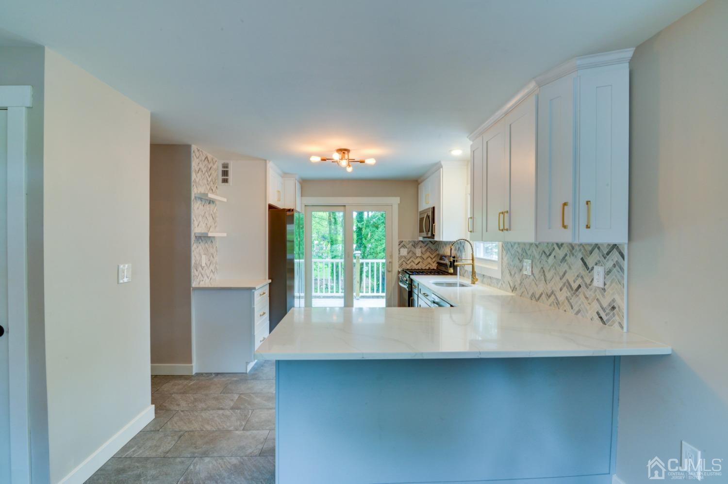 420 Chain O' Hills Road Colonia, NJ 07067 - Photo 12 of 37 a view of kitchen with windows and refrigerator