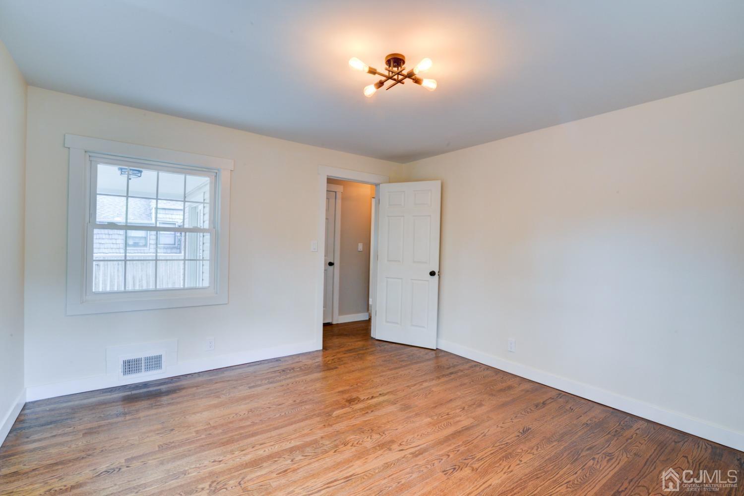 420 Chain O' Hills Road Colonia, NJ 07067 - Photo 16 of 37 a view of an empty room with a window