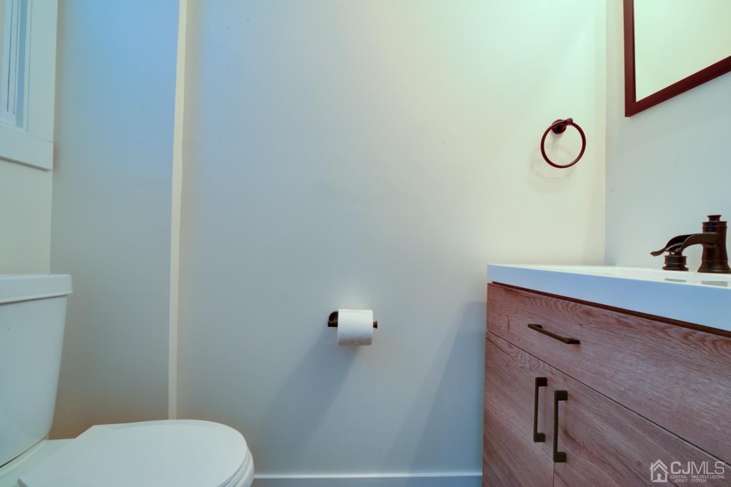 420 Chain O' Hills Road Colonia, NJ 07067 - Photo 17 of 37 a bathroom with a toilet and a sink