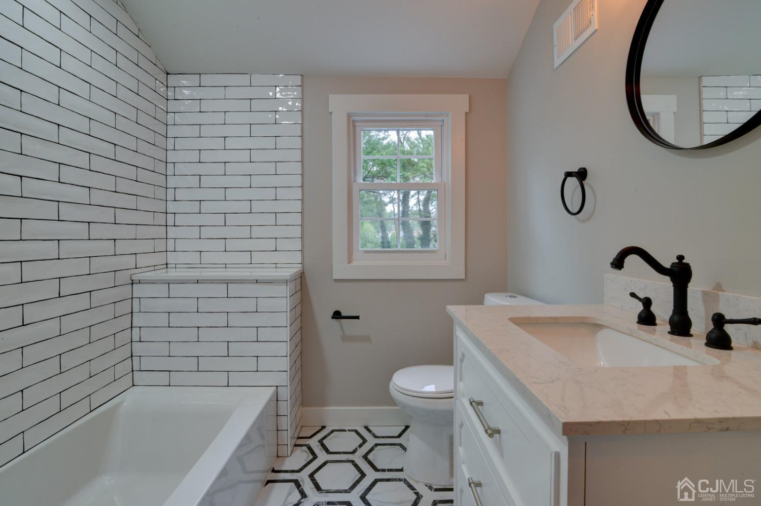 420 Chain O' Hills Road Colonia, NJ 07067 - Photo 25 of 37 a bathroom with a sink a toilet and a bathtub
