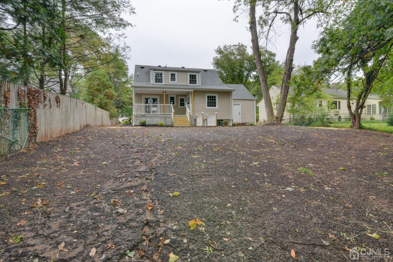 420 Chain O' Hills Road Colonia, NJ 07067 - Photo 32 of 37 a view of a house with a yard and tree s