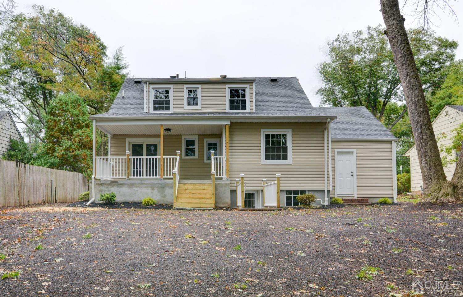 420 Chain O' Hills Road Colonia, NJ 07067 - Photo 33 of 37 a view of a house with a yard and large tree