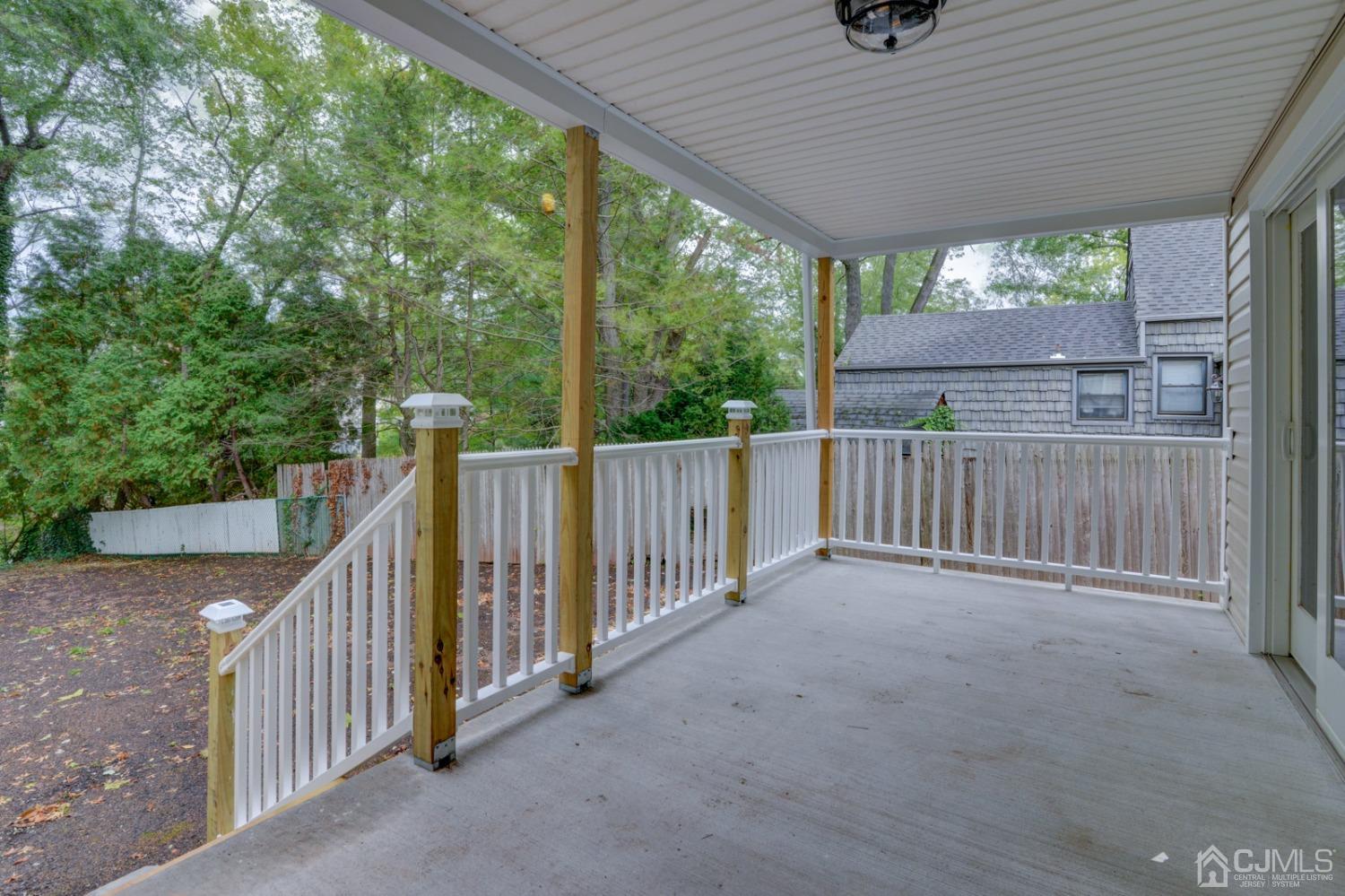 420 Chain O' Hills Road Colonia, NJ 07067 - Photo 34 of 37 a view of a deck with wooden fence and wooden floor