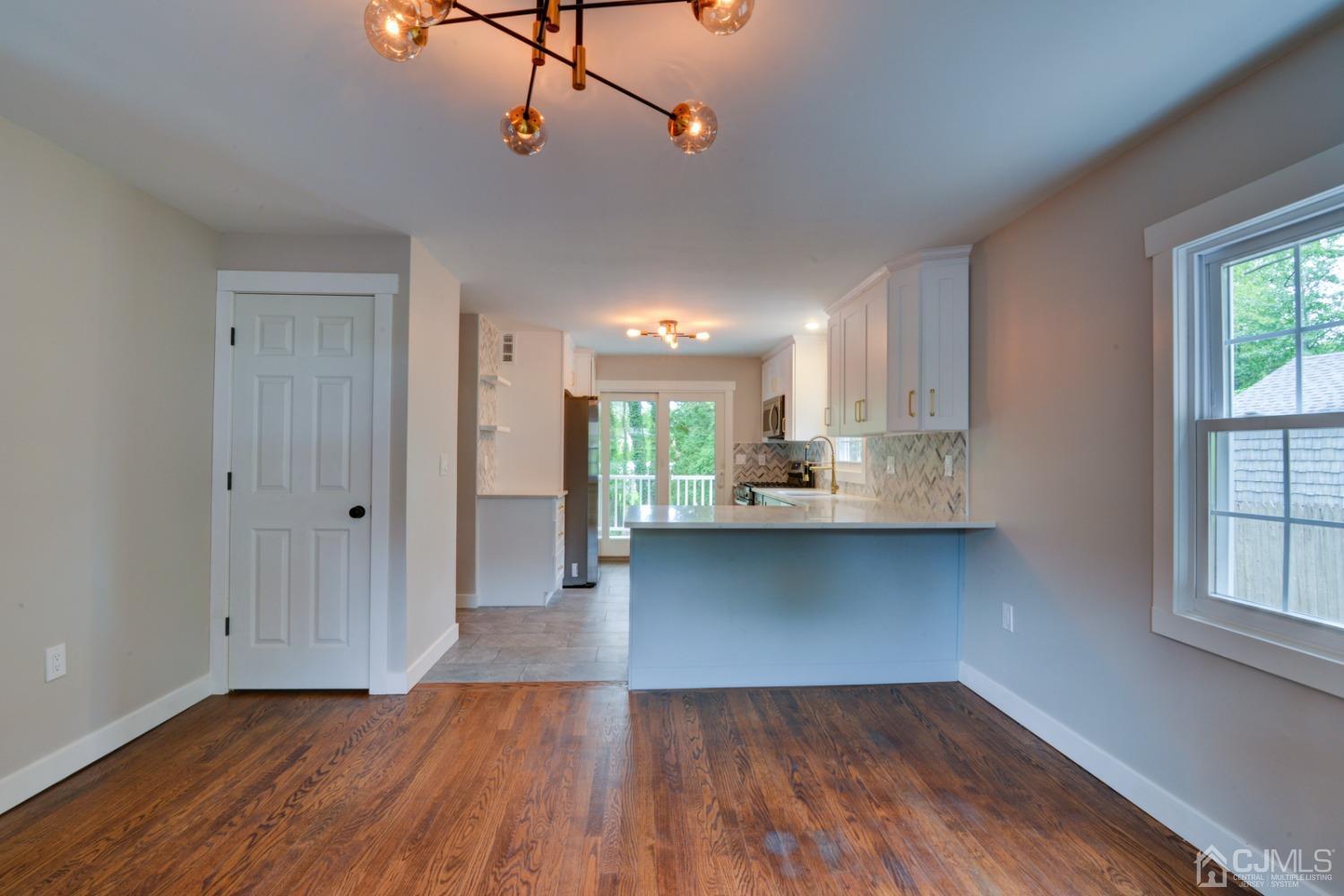 420 Chain O' Hills Road Colonia, NJ 07067 - Photo 10 of 37 a view of a kitchen with wooden floor and a window