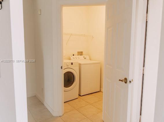 10245 Vía Hibiscus, Unit 10245 Boca Raton, FL 33428 - Photo 7 of 28 a utility room with dryer and washer