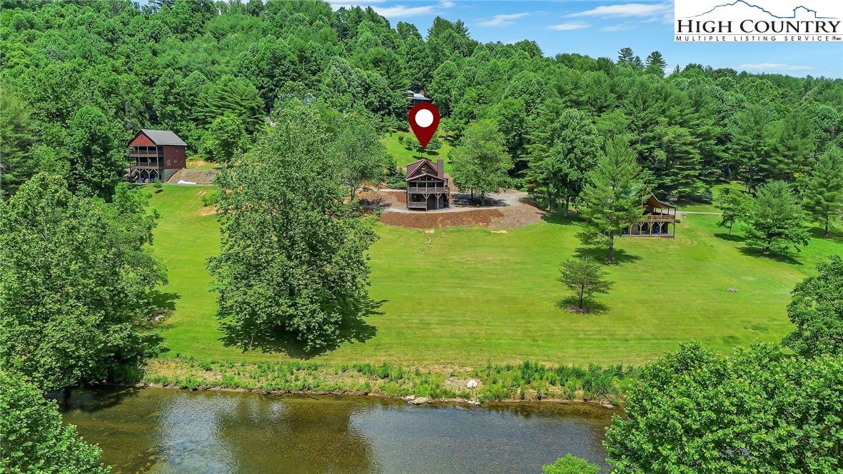 453 South River Hills Road Lansing, NC 28643 - Photo 1 of 48 a picture of street view with an outdoor space