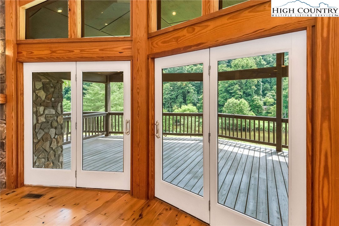 453 South River Hills Road Lansing, NC 28643 - Photo 14 of 48 a view of a balcony with a floor to ceiling window