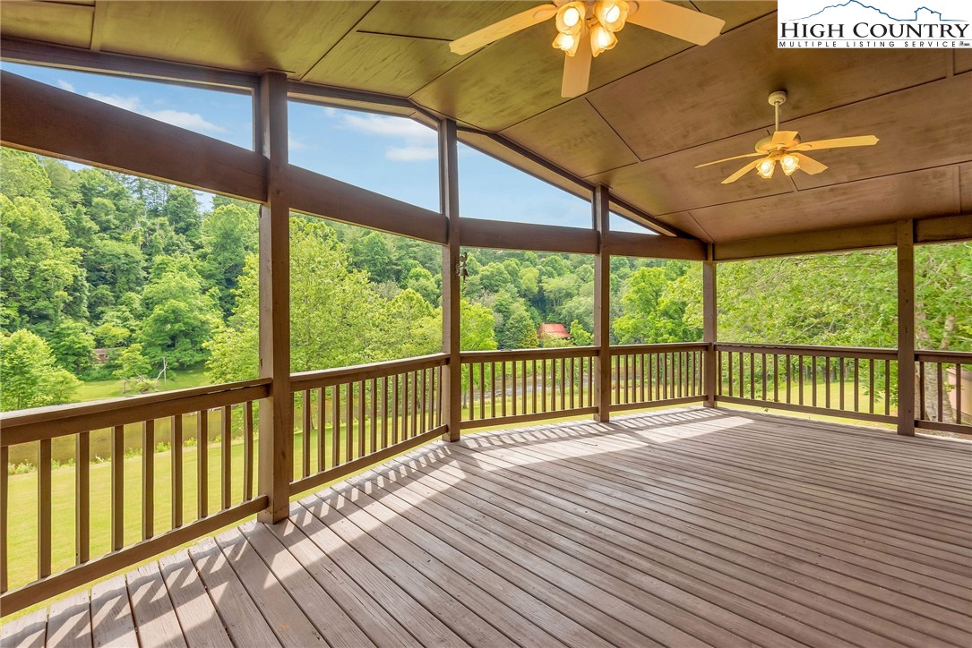 453 South River Hills Road Lansing, NC 28643 - Photo 15 of 48 a view of a balcony with wooden floor
