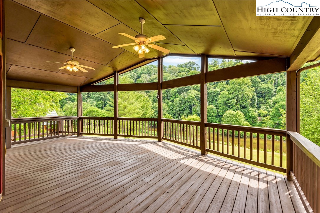 453 South River Hills Road Lansing, NC 28643 - Photo 16 of 48 a view of porch with wooden floor