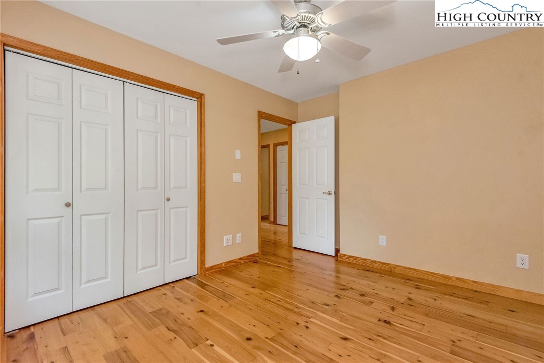 453 South River Hills Road Lansing, NC 28643 - Photo 23 of 48 a view of an empty room with wooden floor