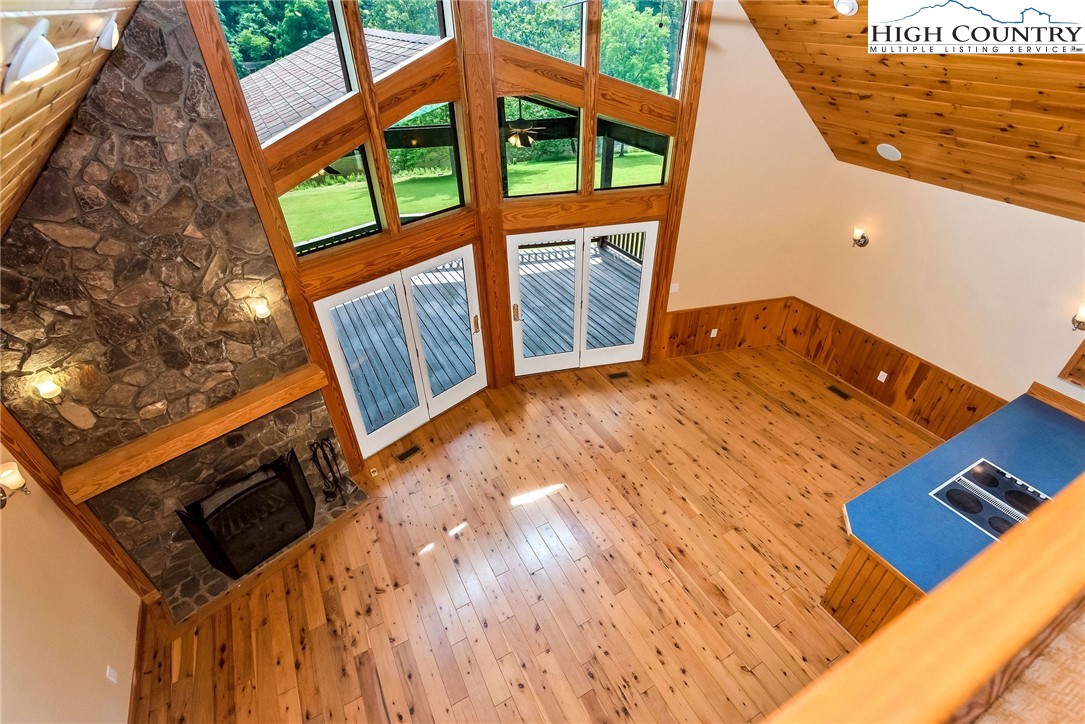 453 South River Hills Road Lansing, NC 28643 - Photo 28 of 48 a view of an chairs and floor to ceiling window