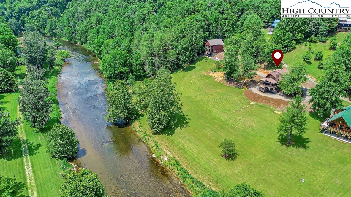 453 South River Hills Road Lansing, NC 28643 - Photo 3 of 48 an aerial view of residential house with outdoor space and trees all around