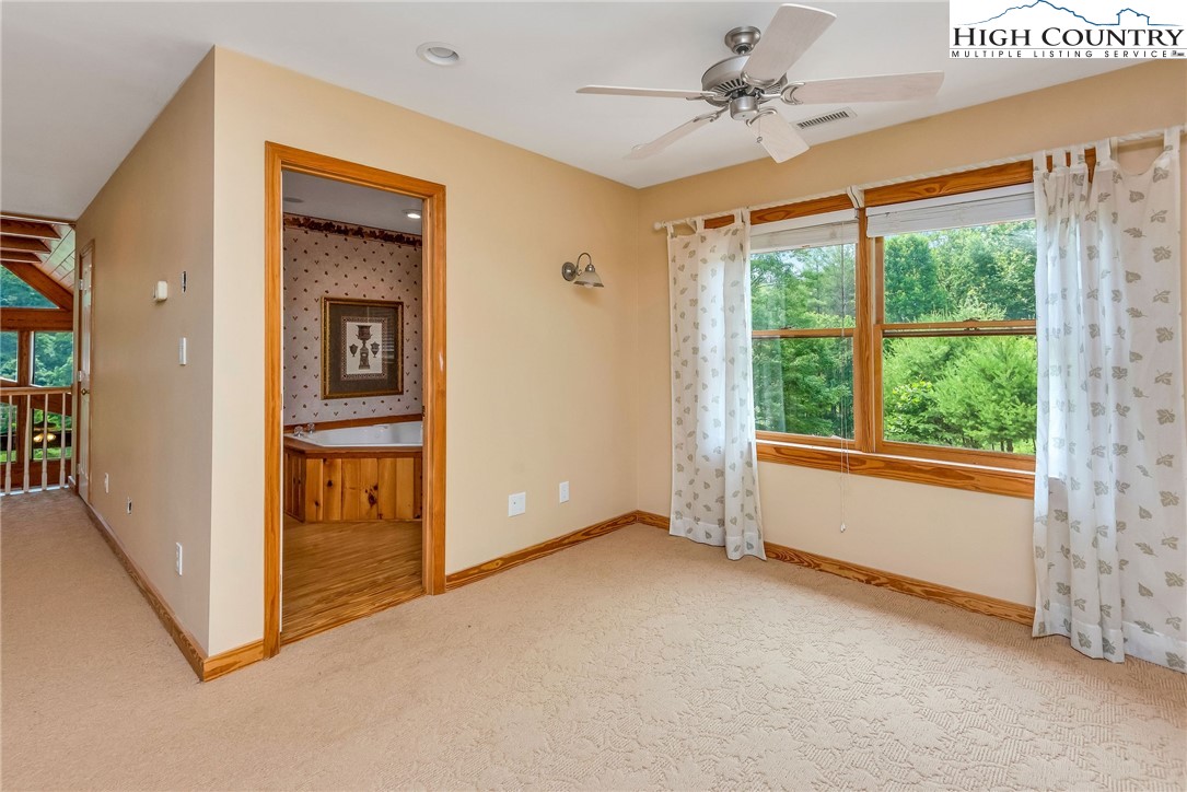 453 South River Hills Road Lansing, NC 28643 - Photo 32 of 48 wooden floor in an empty room with a window