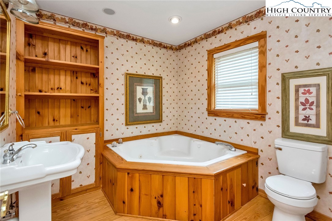 453 South River Hills Road Lansing, NC 28643 - Photo 35 of 48 a bathroom with a sink and a toilet