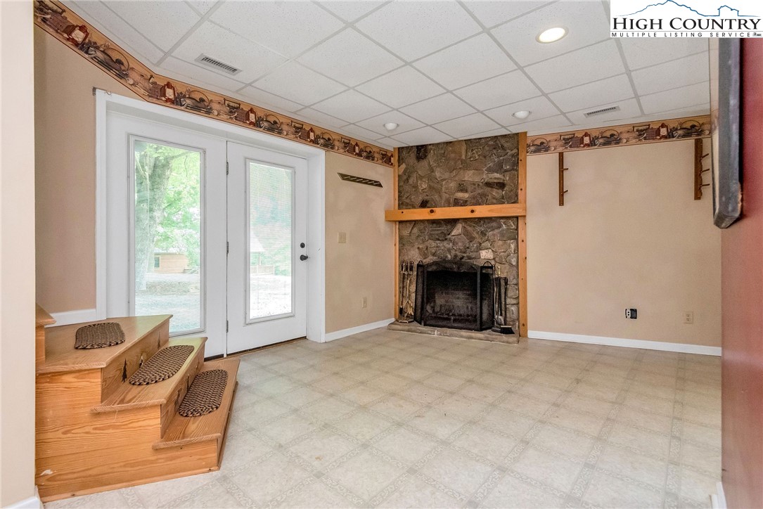453 South River Hills Road Lansing, NC 28643 - Photo 41 of 48 a view of livingroom with furniture and a fireplace