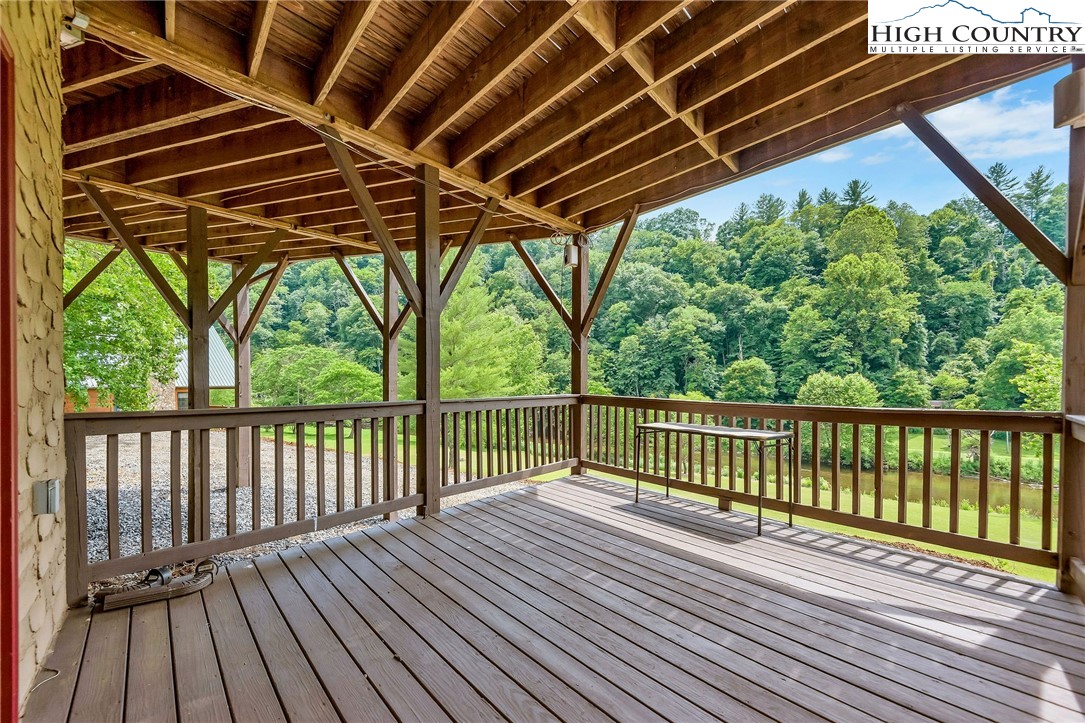453 South River Hills Road Lansing, NC 28643 - Photo 42 of 48 a view of balcony with wooden floor and fence