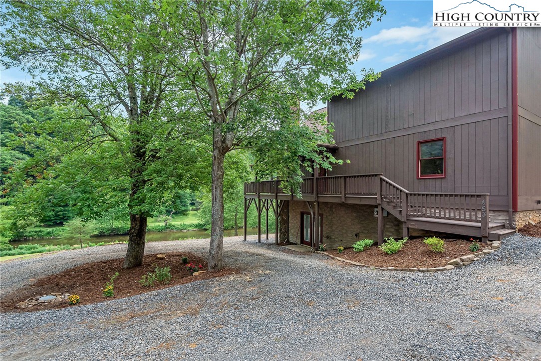 453 South River Hills Road Lansing, NC 28643 - Photo 43 of 48 a view of a house with a yard and tree