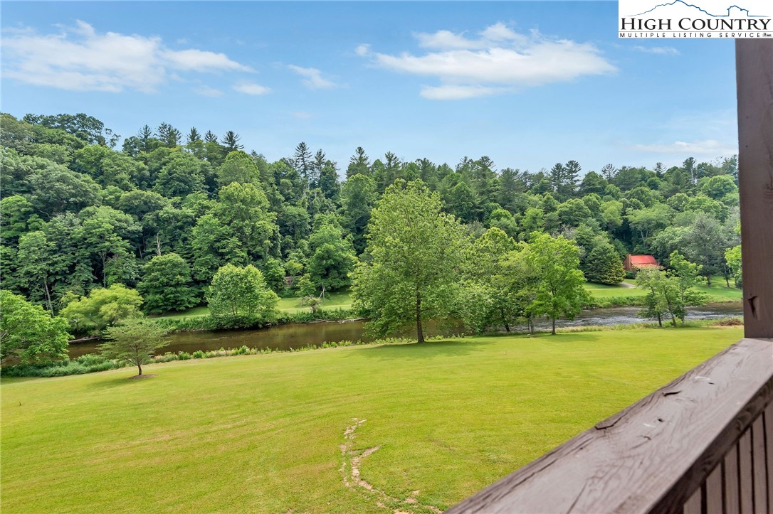 453 South River Hills Road Lansing, NC 28643 - Photo 44 of 48 a view of a lake with a big yard