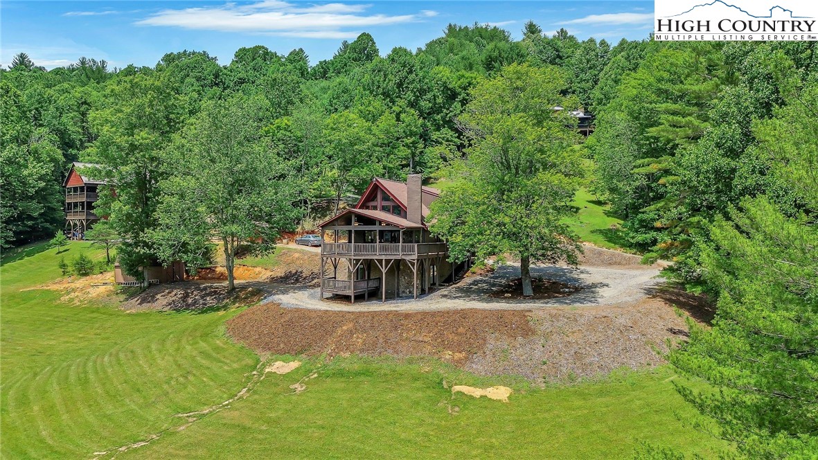 453 South River Hills Road Lansing, NC 28643 - Photo 6 of 48 a view of a house with a yard