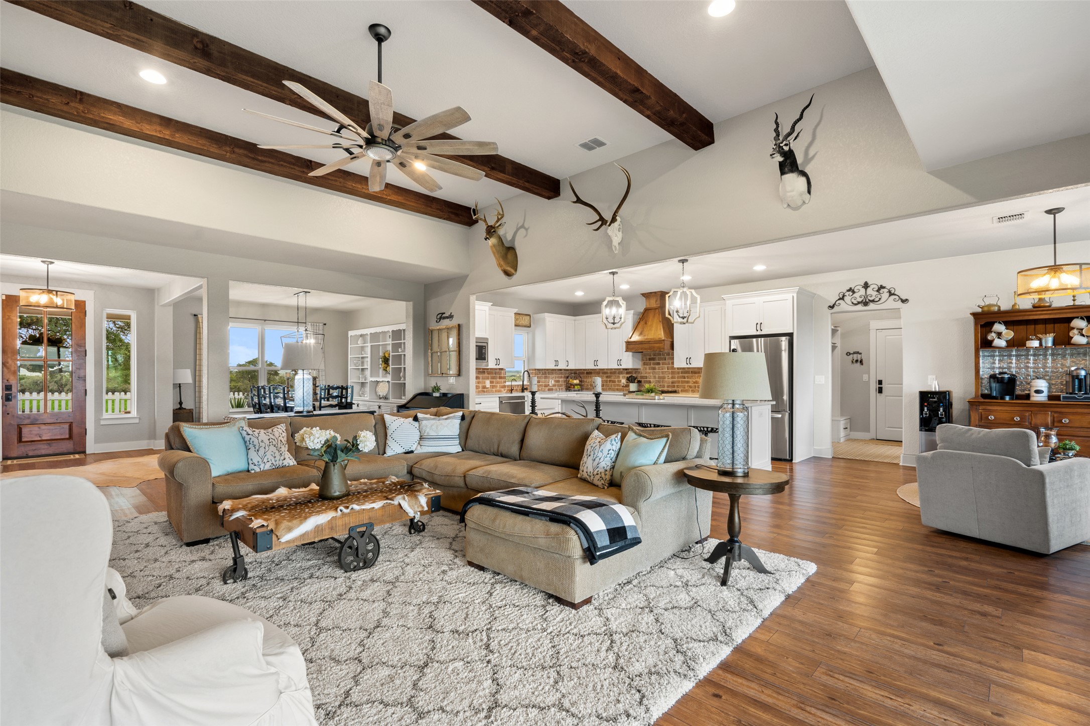 2454 McKinney Loop Blanco, TX 78606 - Photo 12 of 21 a living room with lots of furniture and kitchen view