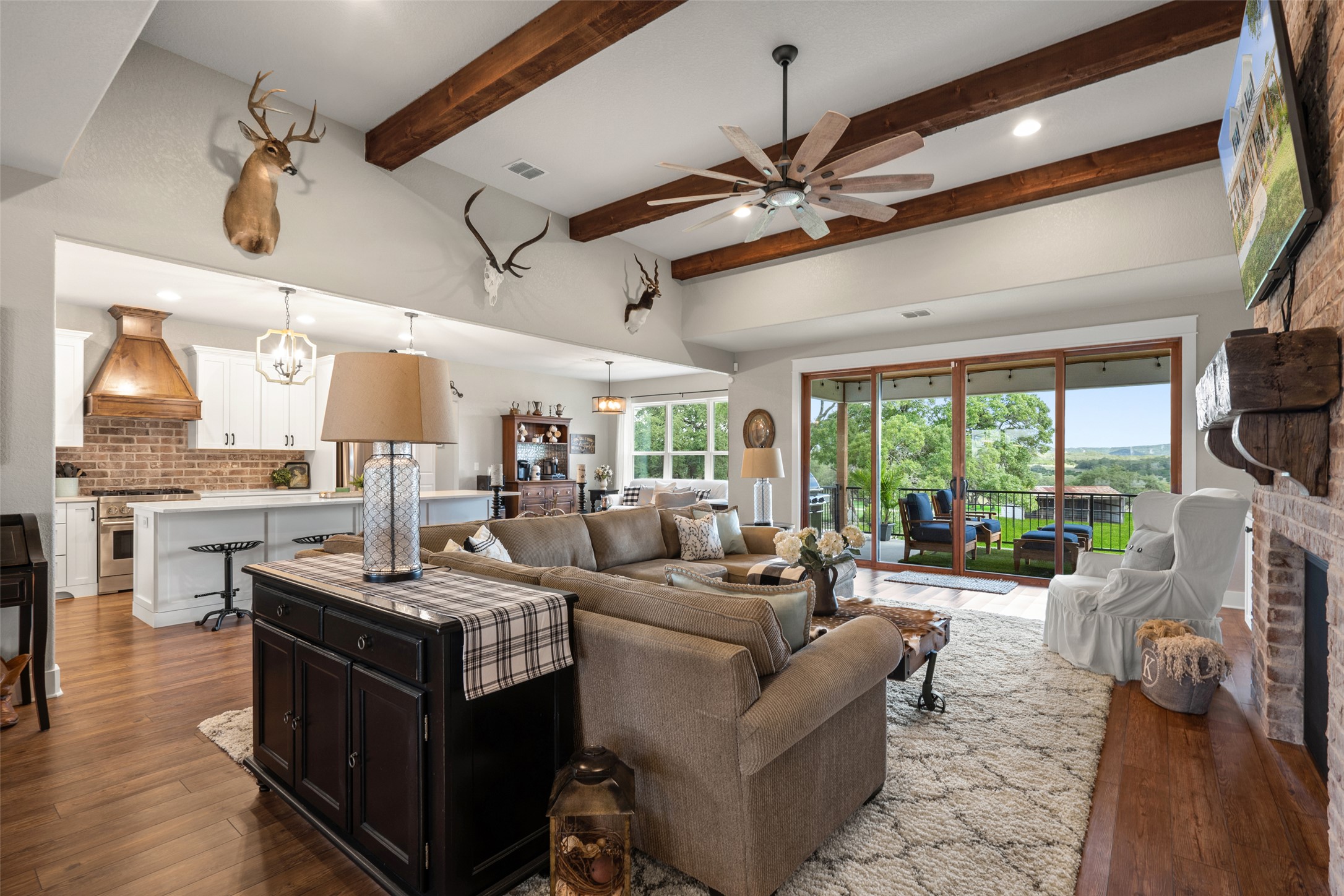 2454 McKinney Loop Blanco, TX 78606 - Photo 14 of 21 a living room with fireplace furniture and a large window