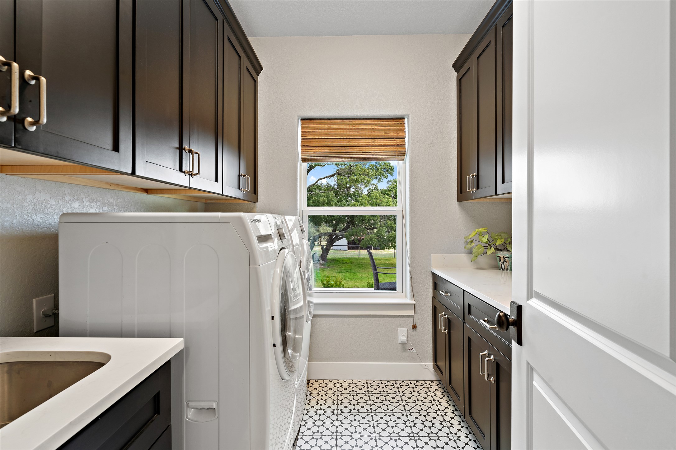 2454 McKinney Loop Blanco, TX 78606 - Photo 17 of 21 a kitchen with a sink and a refrigerator