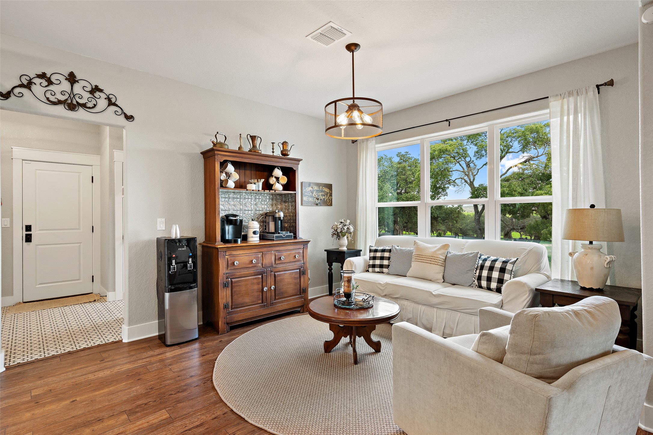 2454 McKinney Loop Blanco, TX 78606 - Photo 18 of 21 a living room with furniture and a chandelier