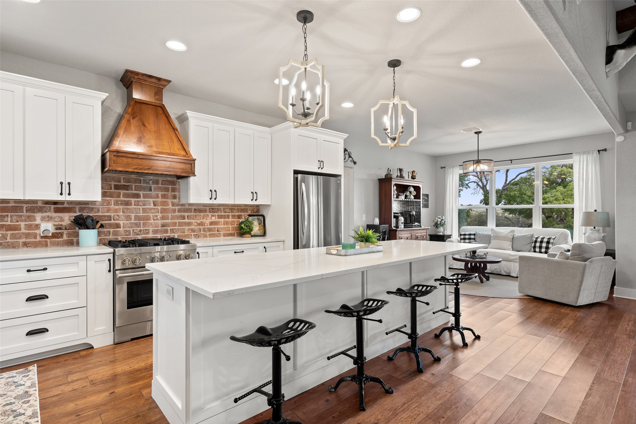 2454 McKinney Loop Blanco, TX 78606 - Photo 20 of 21 a large kitchen with a table and chairs