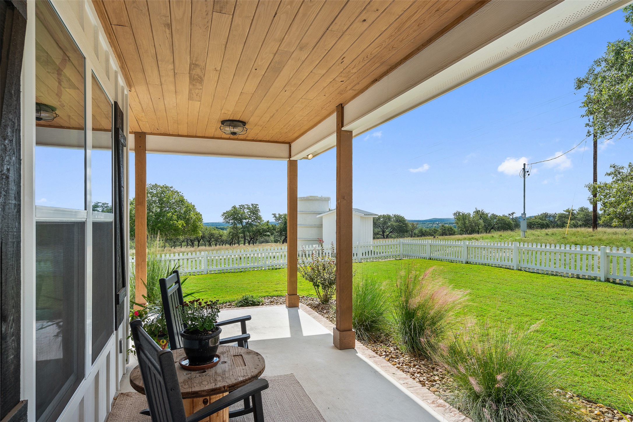 2454 McKinney Loop Blanco, TX 78606 - Photo 21 of 21 a view of swimming pool with outdoor seating and lake view