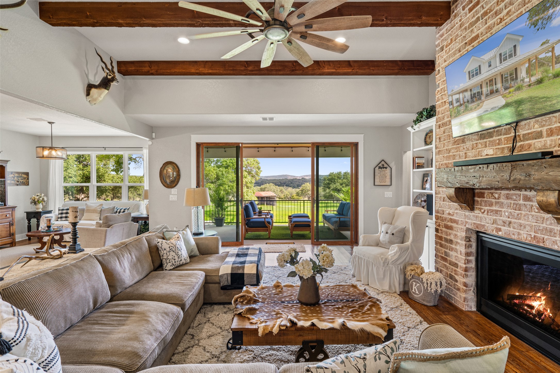 2454 McKinney Loop Blanco, TX 78606 - Photo 3 of 21 a living room with furniture and a fireplace