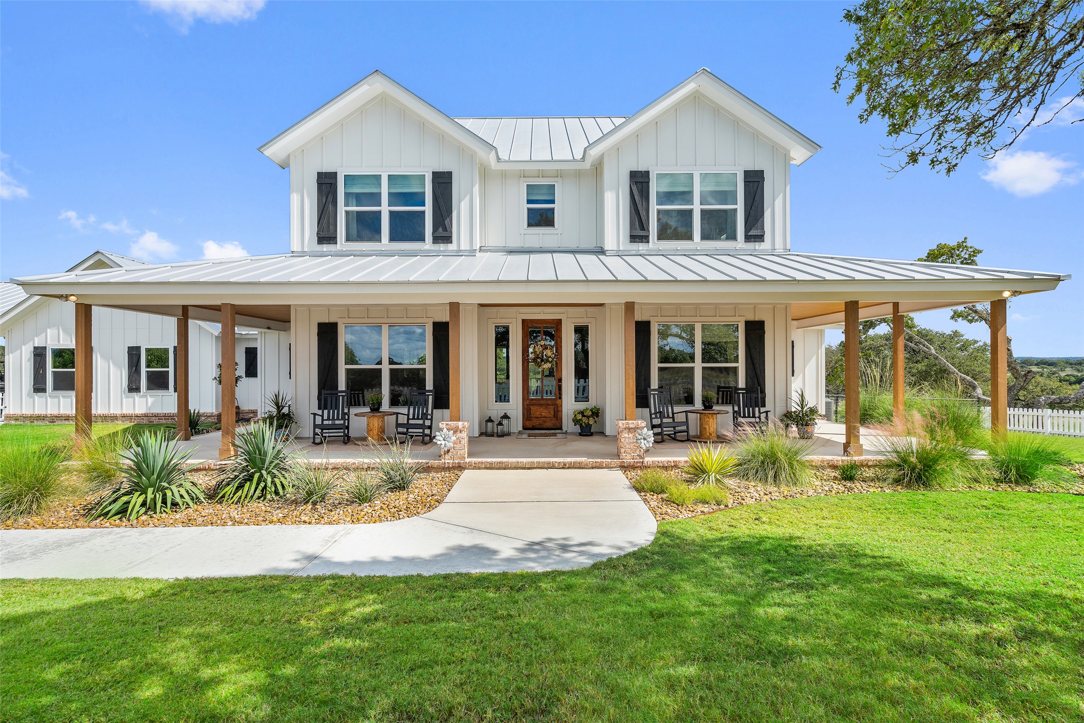 2454 McKinney Loop Blanco, TX 78606 - Photo 4 of 21 front view of a house with a yard