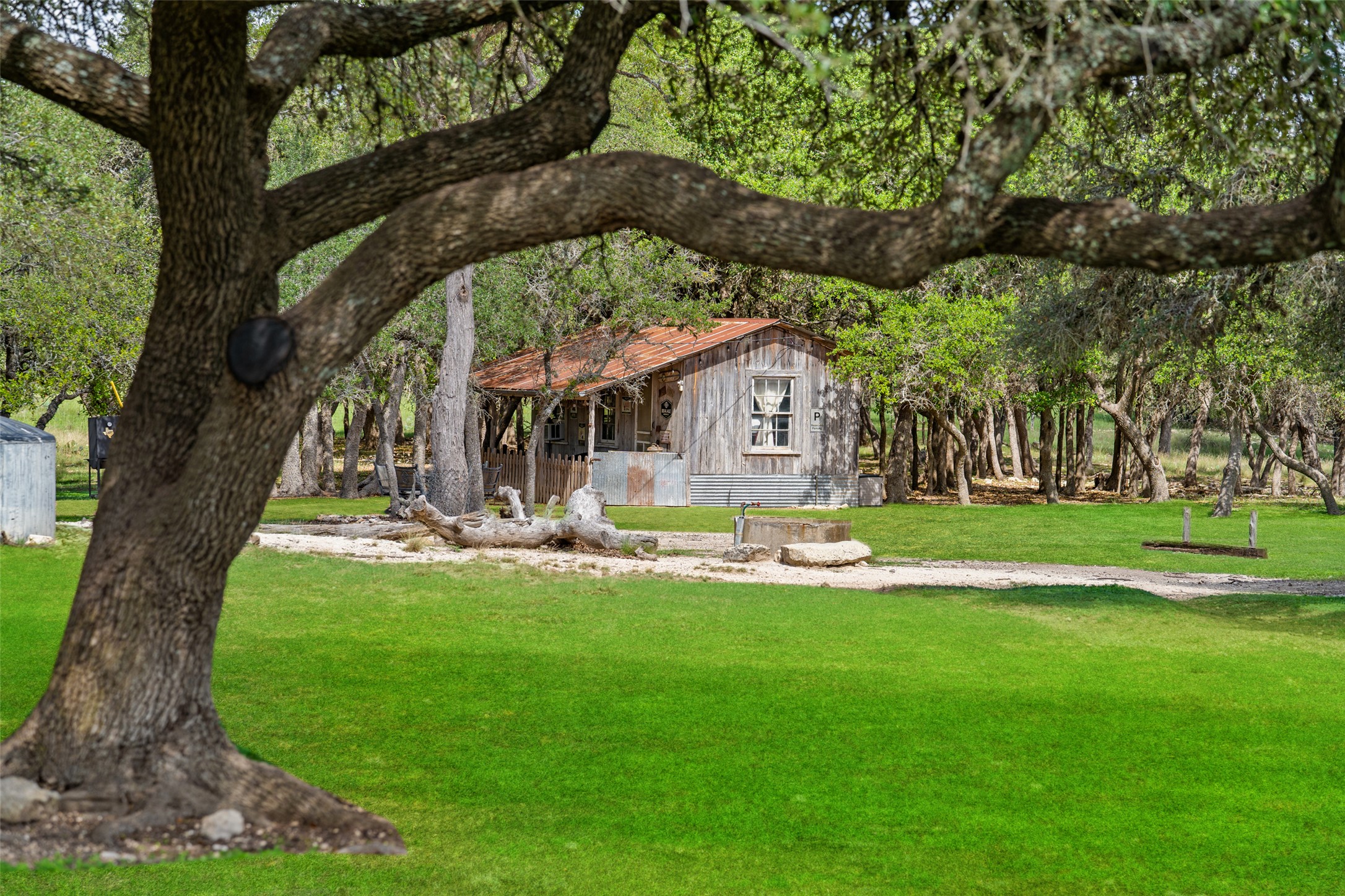 2454 McKinney Loop Blanco, TX 78606 - Photo 9 of 21 a view of a house with backyard porch and sitting area