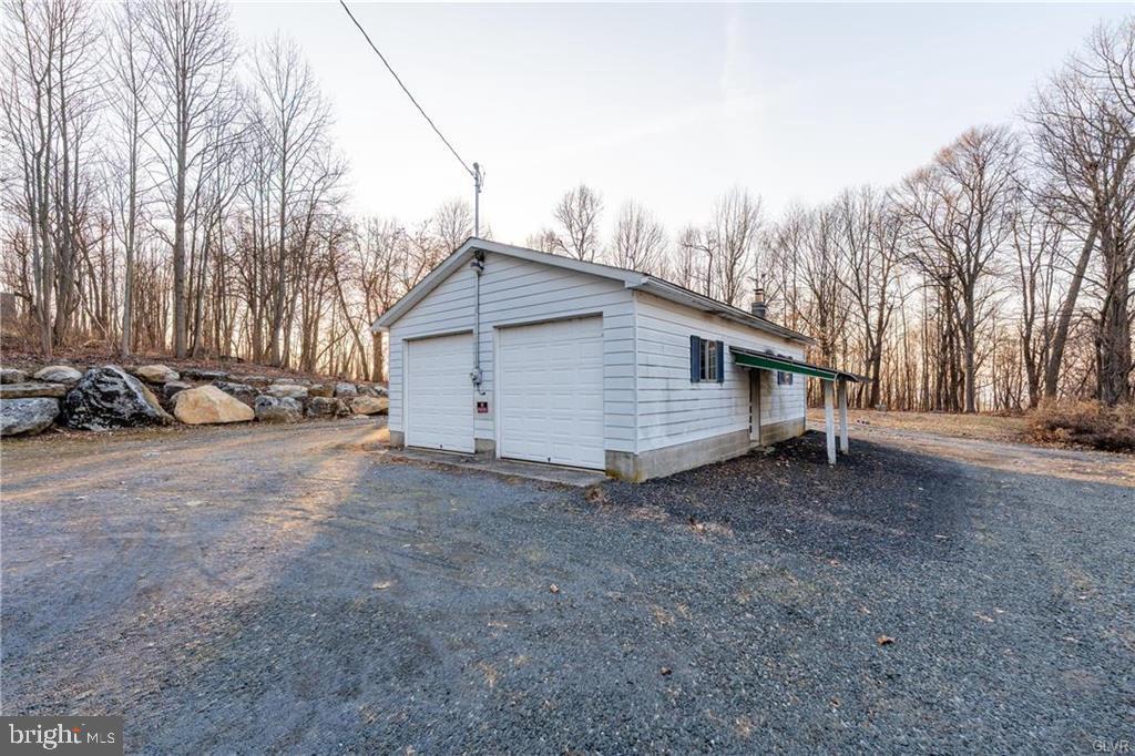 4835 Shimerville Road Emmaus, PA 18049 - Photo 10 of 16 a view of a house with a yard and parked area