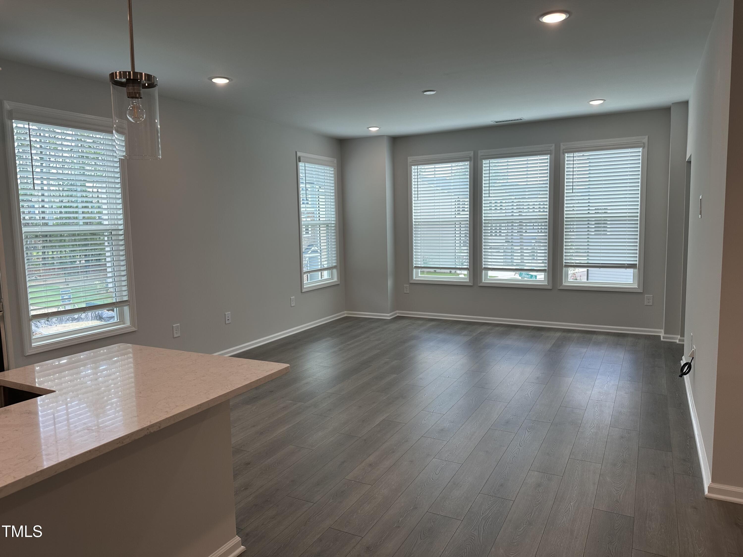 2209 Lambert Road Cary, NC 27519 - Photo 11 of 51 wooden floor in an empty room with a window
