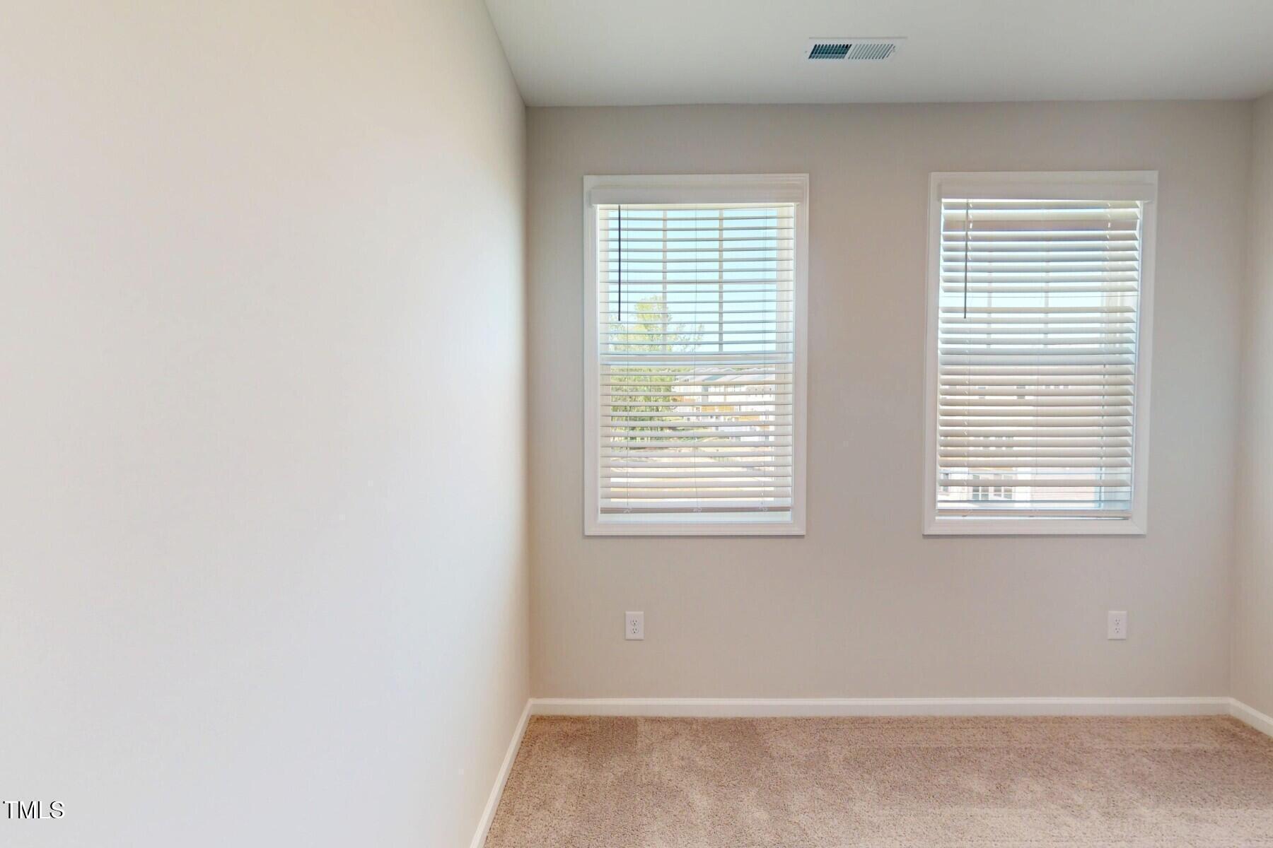 2209 Lambert Road Cary, NC 27519 - Photo 28 of 51 a view of an empty room with a window
