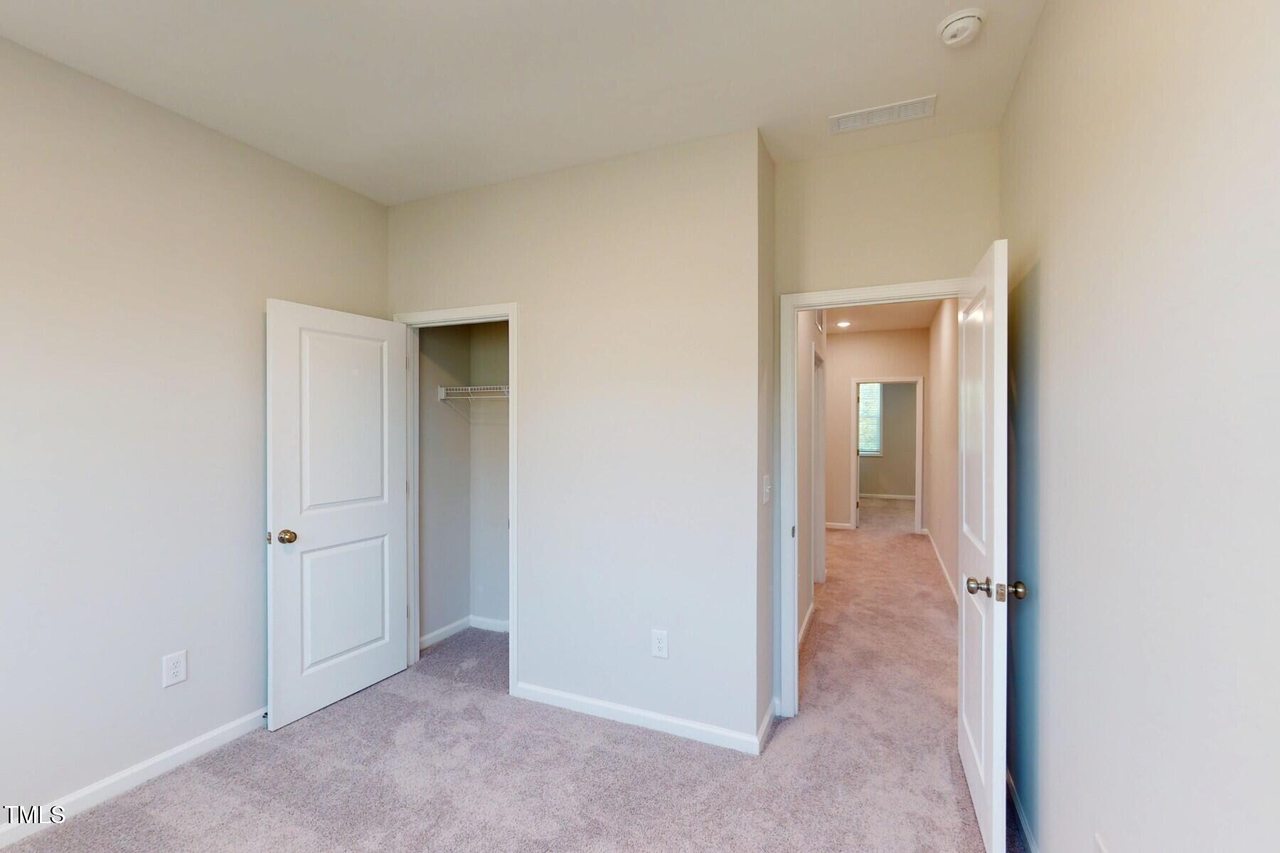 2209 Lambert Road Cary, NC 27519 - Photo 29 of 51 an empty room with closet and a bathroom