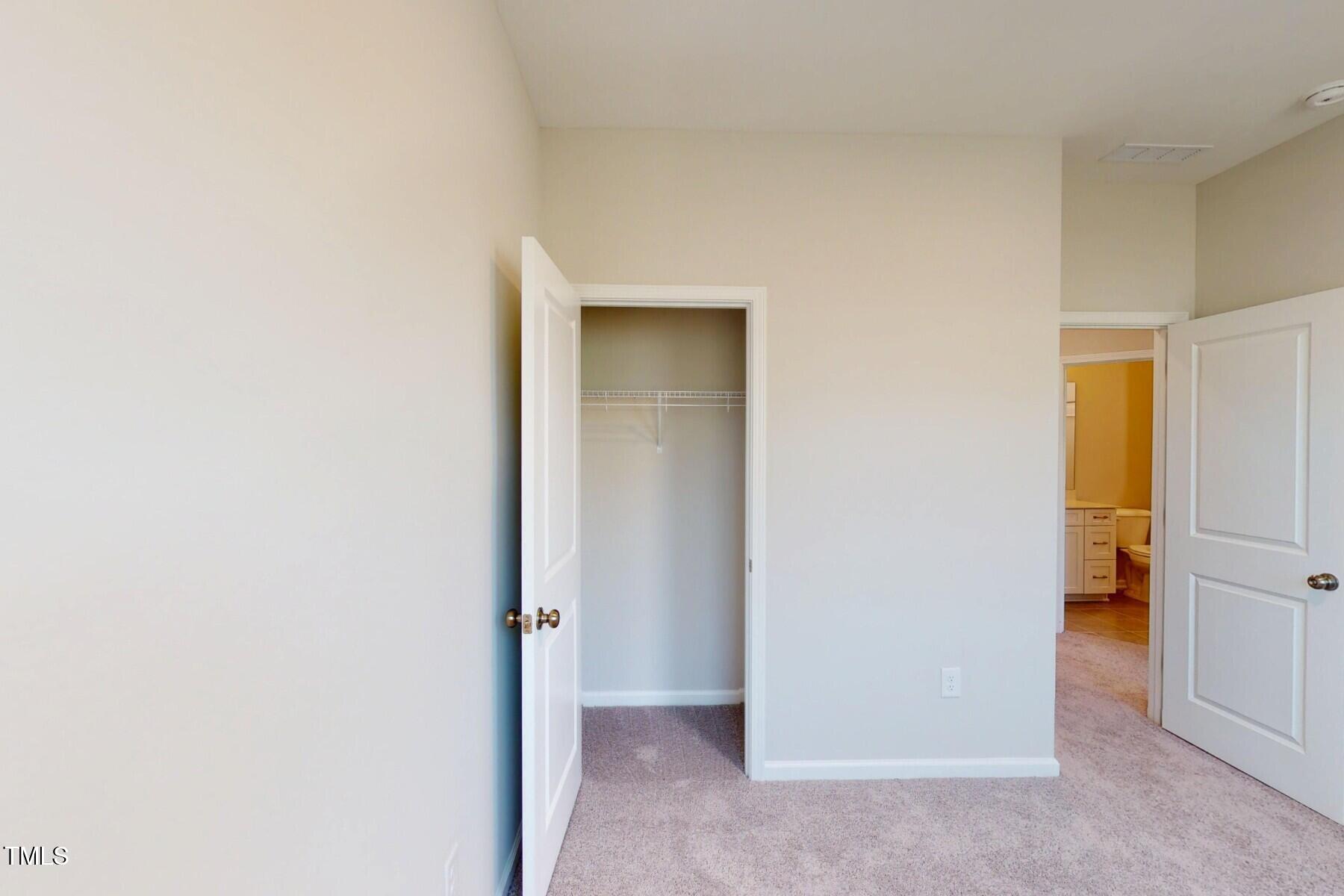 2209 Lambert Road Cary, NC 27519 - Photo 30 of 51 a view of a livingroom with a walk in closet and bathroom