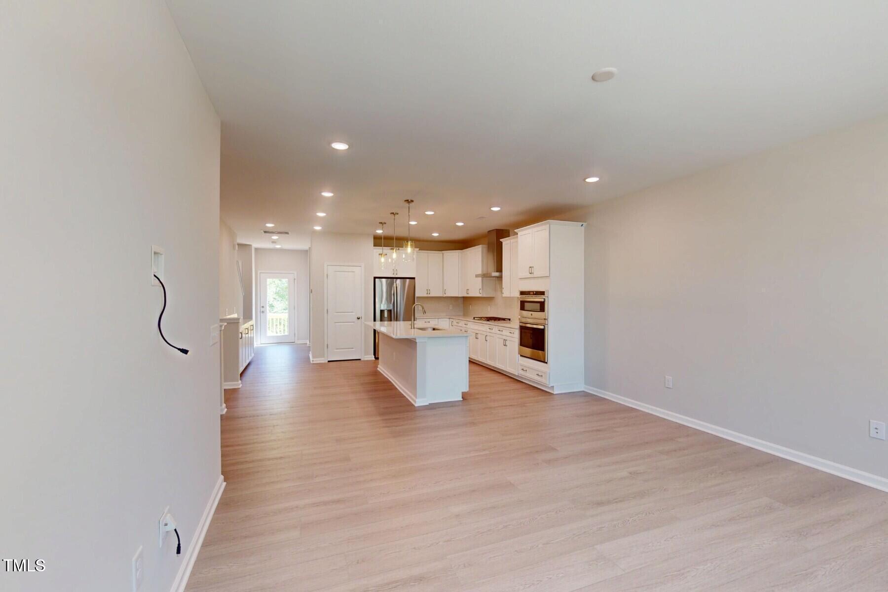 2209 Lambert Road Cary, NC 27519 - Photo 4 of 51 a view of kitchen dining table chairs microwave and cabinets