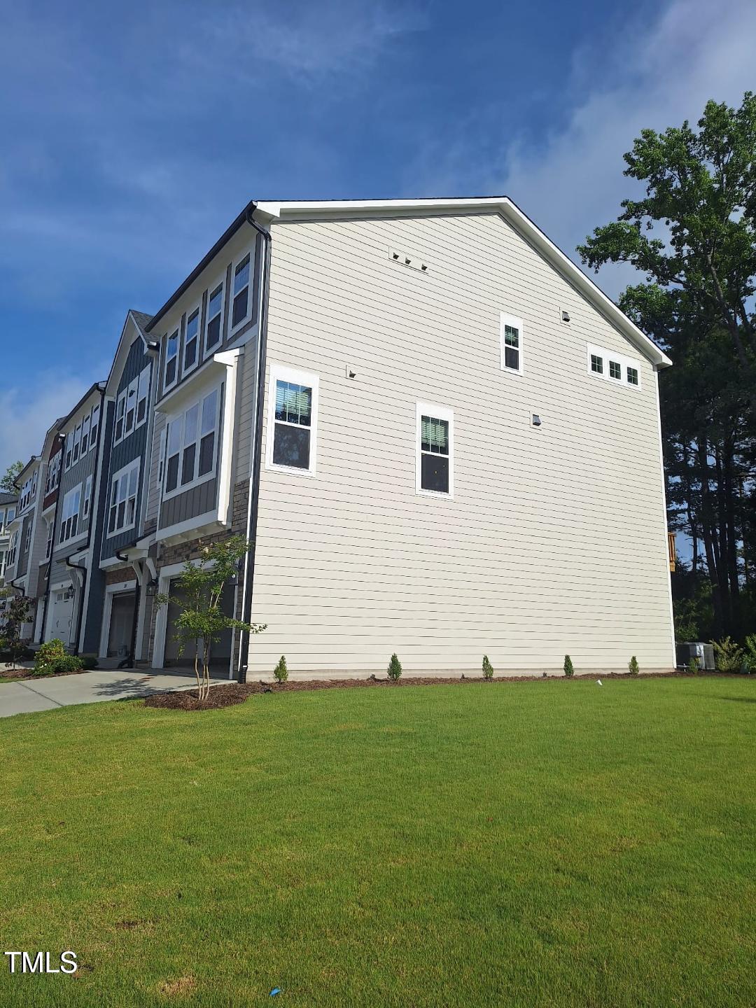 2209 Lambert Road Cary, NC 27519 - Photo 48 of 51 a view of a back yard of the house